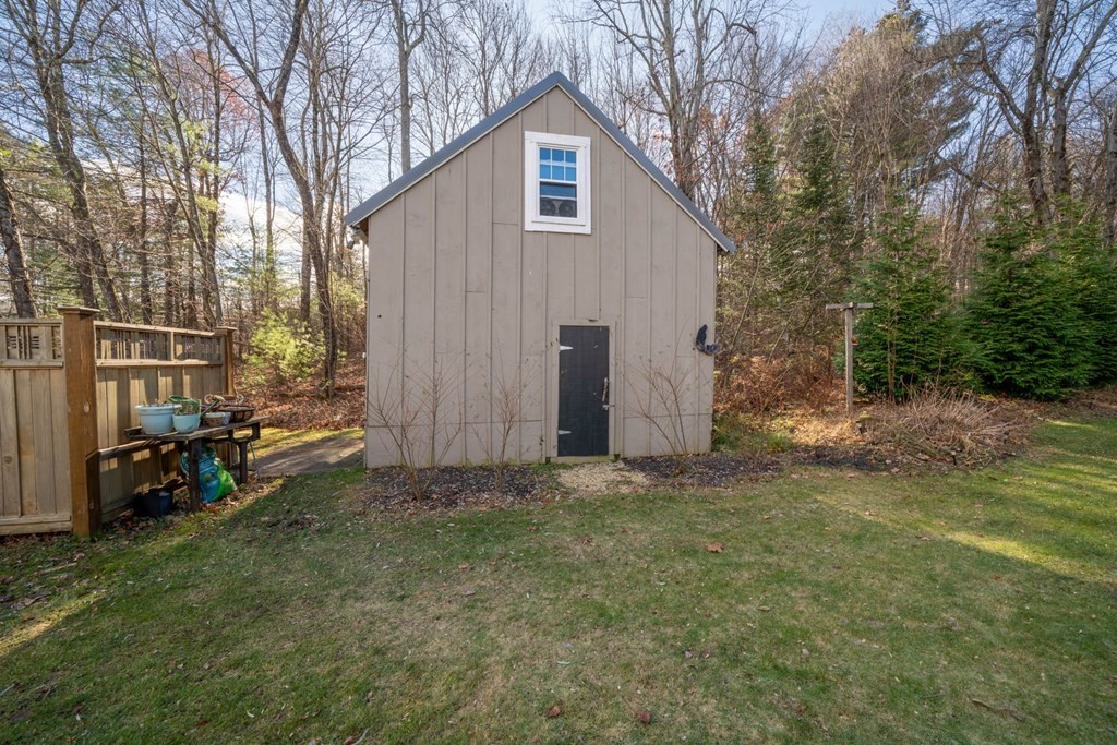 272 Harvard Road Bolton, MA 01740 - Photo 4 of 42 a backyard of a house with table and chairs