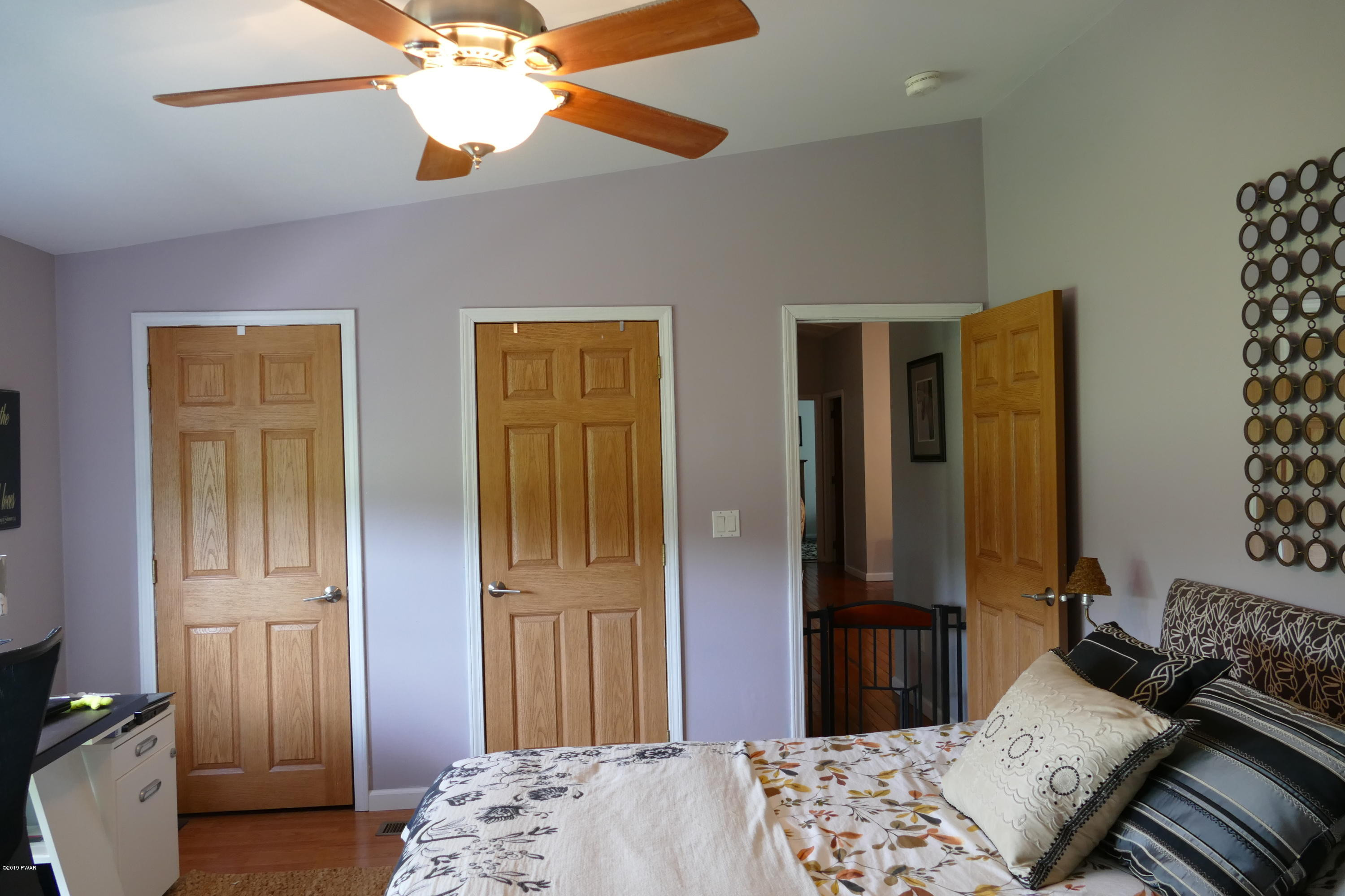 108 Savitz Road Moscow, PA 18444 - Photo 32 of 46 a bedroom with bed and wooden floor