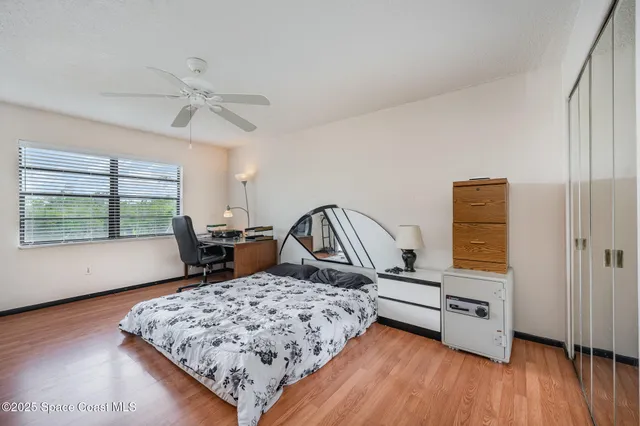 a bedroom with furniture and flat screen tv