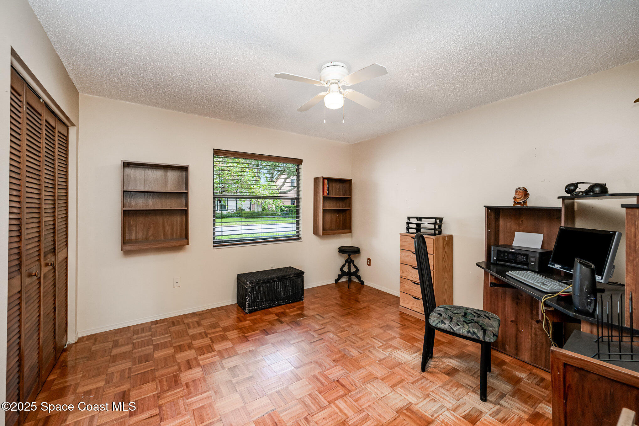1635 Sandpiper Street Merritt Island, FL 32952 - Photo 22 of 31 a view of a workspace with furniture and a window