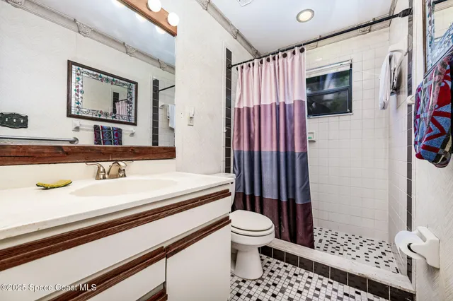 a bedroom with bed and window