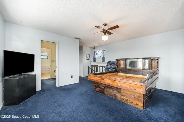 a view of room with furniture and a ceiling fan