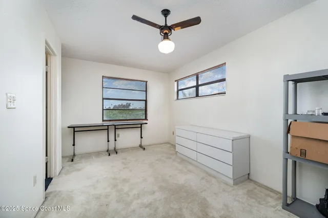 a bathroom with a sink toilet vanity and mirror