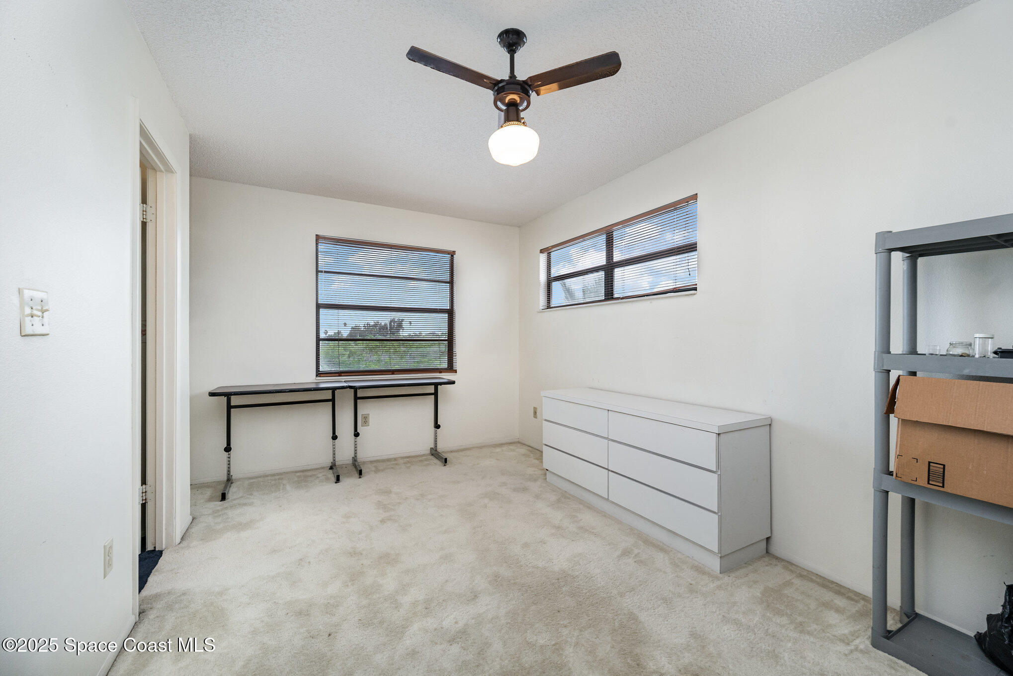 1635 Sandpiper Street Merritt Island, FL 32952 - Photo 26 of 31 a view of room with furniture and a ceiling fan