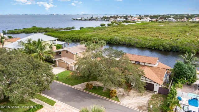 a view of a swimming pool with an outdoor seating