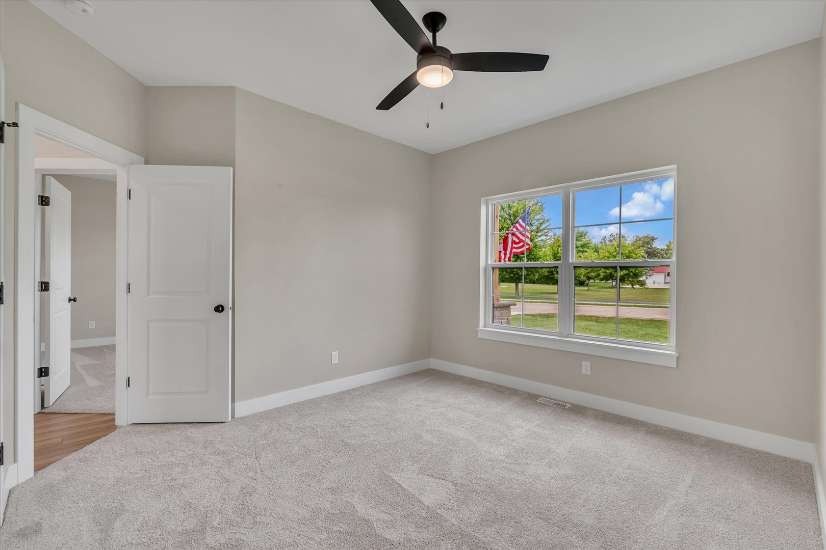 455 Rhonda Road New Liberty, IA 52765 - Photo 43 of 54 a view of an empty room with a window