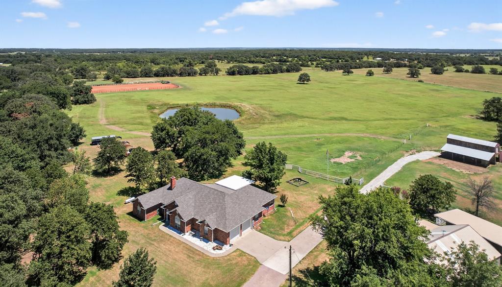 482 Center Hill Road Gainesville, TX 76240 - Photo 1 of 38 an aerial view of a houses with ocean view