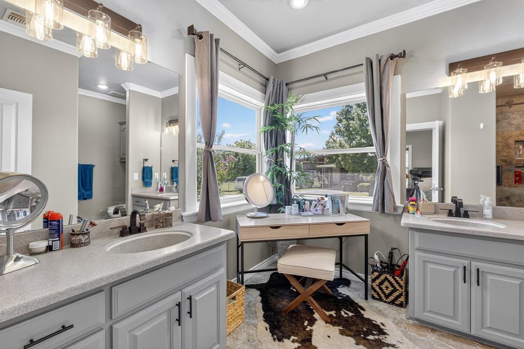 482 Center Hill Road Gainesville, TX 76240 - Photo 13 of 38 a view of a sink and a dining table in a kitchen