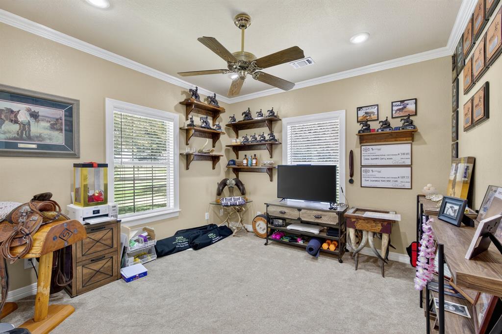 482 Center Hill Road Gainesville, TX 76240 - Photo 18 of 38 a view of a workspace with furniture and a window