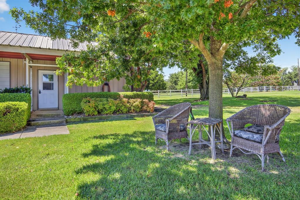 482 Center Hill Road Gainesville, TX 76240 - Photo 24 of 38 a view of a chair and table in backyard of the house