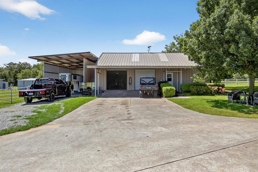 482 Center Hill Road Gainesville, TX 76240 - Photo 25 of 38 a view of a house with a garden and pathway