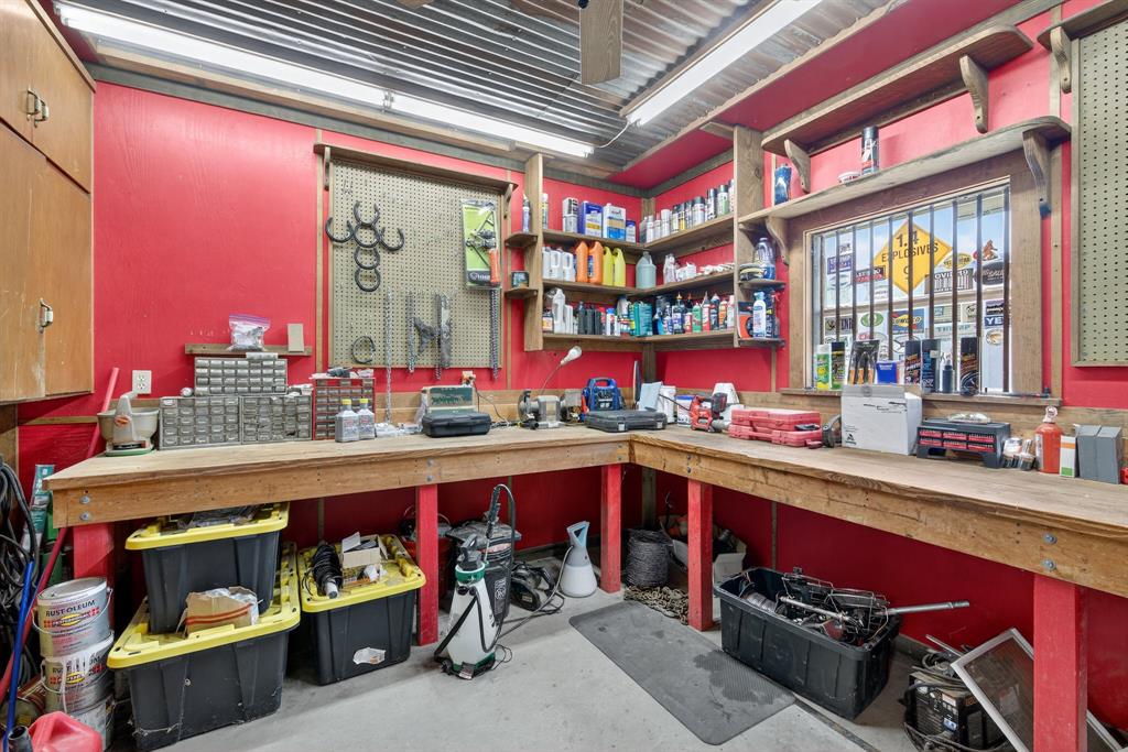482 Center Hill Road Gainesville, TX 76240 - Photo 27 of 38 a utility room with stainless steel appliances granite countertop a sink and wooden floors
