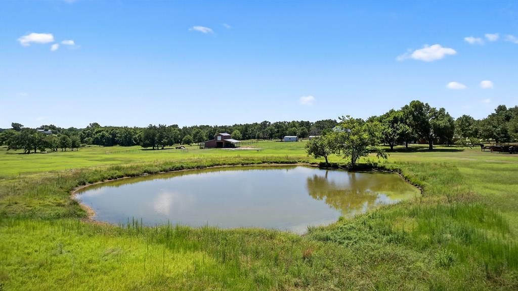 482 Center Hill Road Gainesville, TX 76240 - Photo 32 of 38 a view of a lake with houses in the background