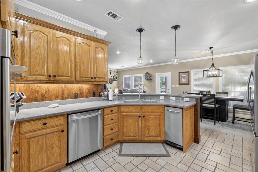 482 Center Hill Road Gainesville, TX 76240 - Photo 8 of 38 a kitchen with a sink counter top space and appliances