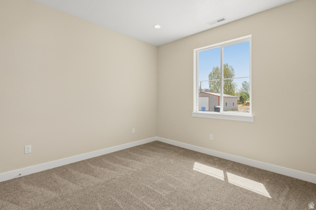 157 West 100 South Joseph, UT 84739 - Photo 23 of 30 Empty room with light colored carpet and recessed lighting