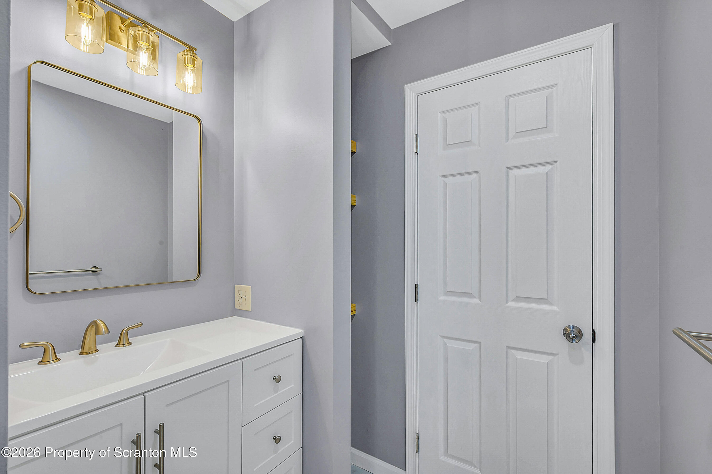 460 Newcomb Road Factoryville, PA 18419 - Photo 12 of 40 a bathroom with a sink and a mirror