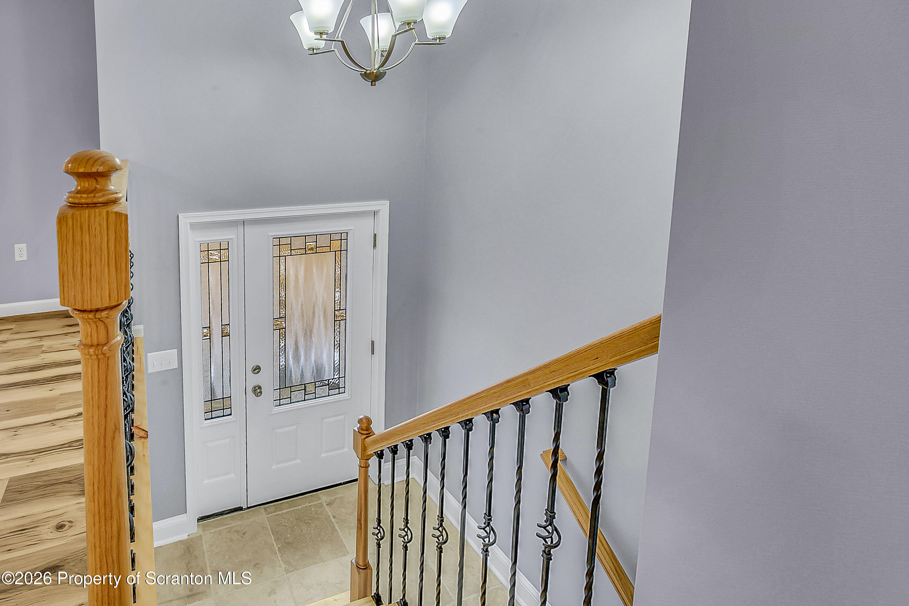 460 Newcomb Road Factoryville, PA 18419 - Photo 13 of 40 a view of a hallway with wooden floor and staircase