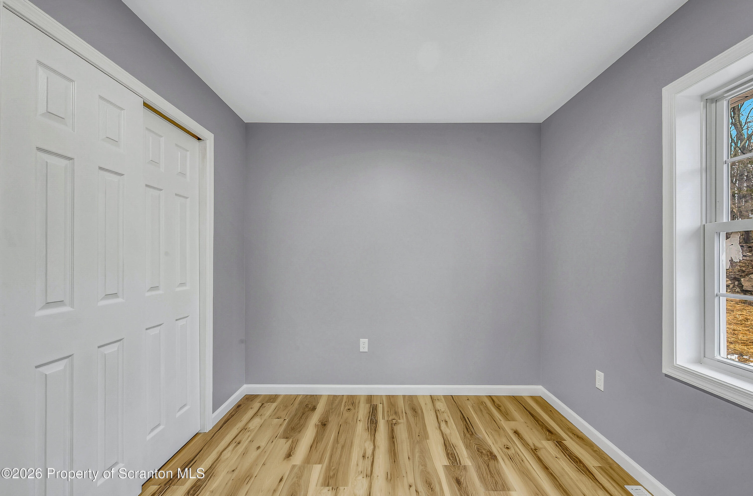 460 Newcomb Road Factoryville, PA 18419 - Photo 14 of 40 a view of a room with wooden floor and a window