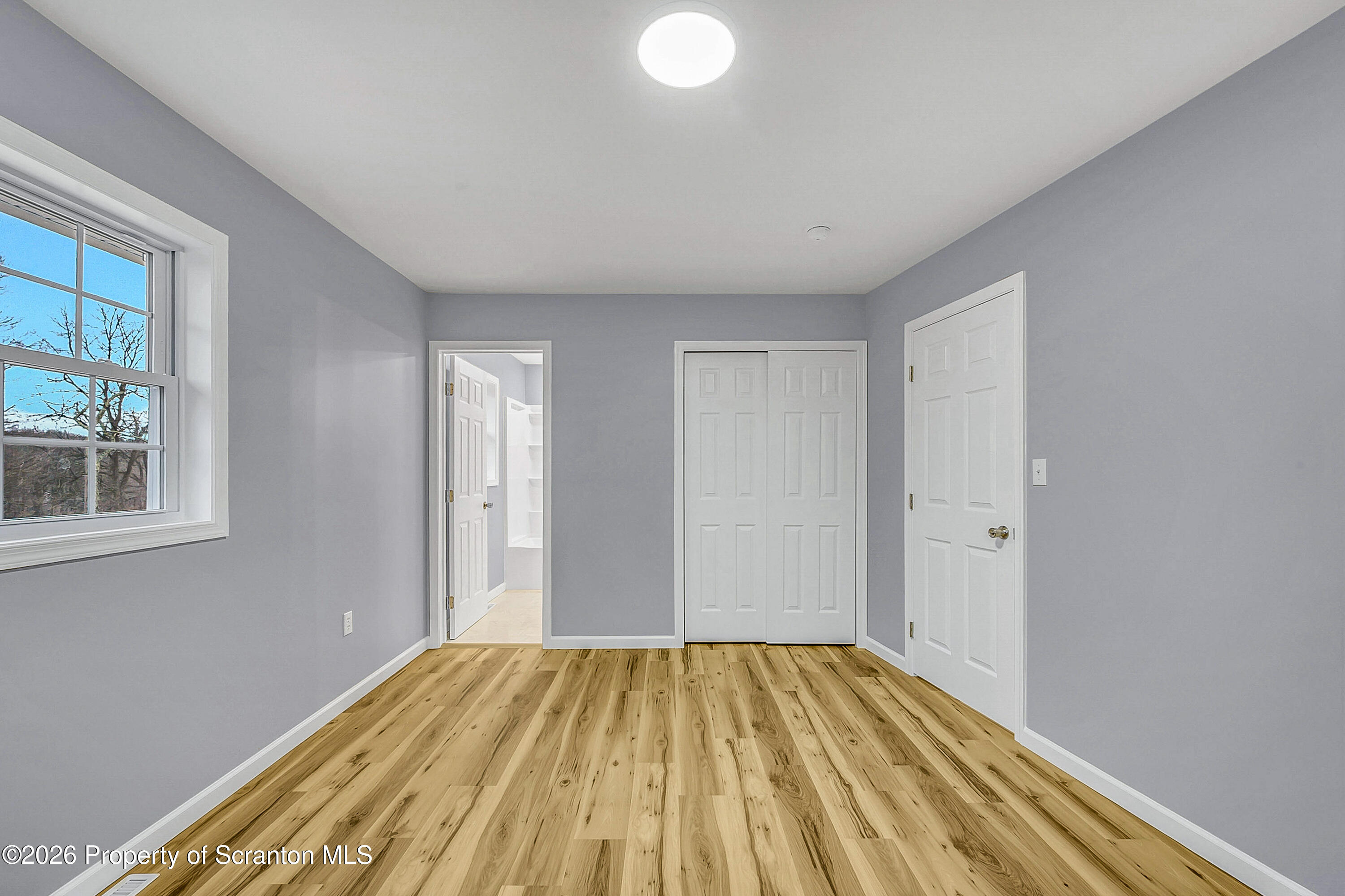 460 Newcomb Road Factoryville, PA 18419 - Photo 19 of 40 a view of a room with wooden floor and bathroom