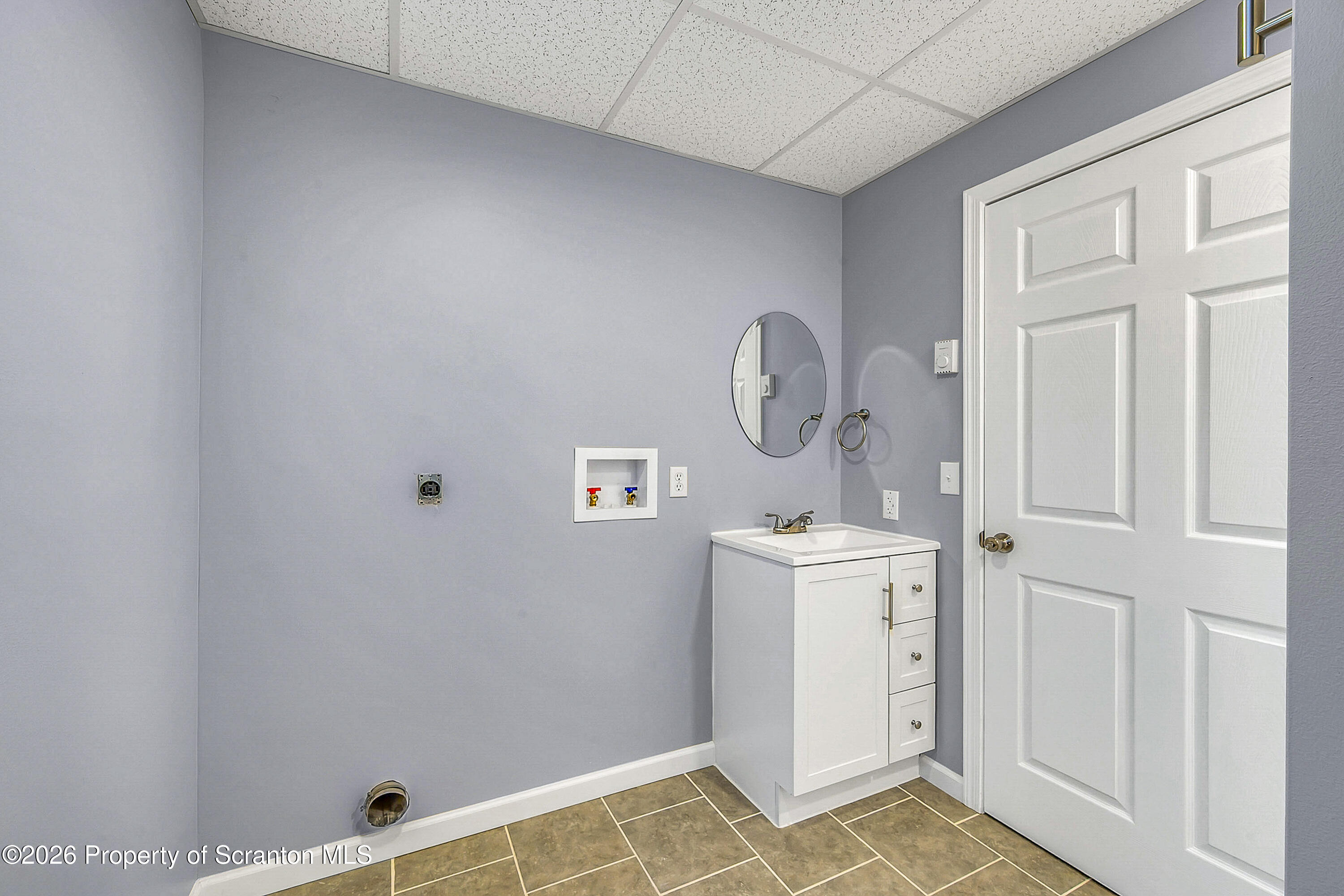 460 Newcomb Road Factoryville, PA 18419 - Photo 25 of 40 a view of a bathroom with sink and mirror