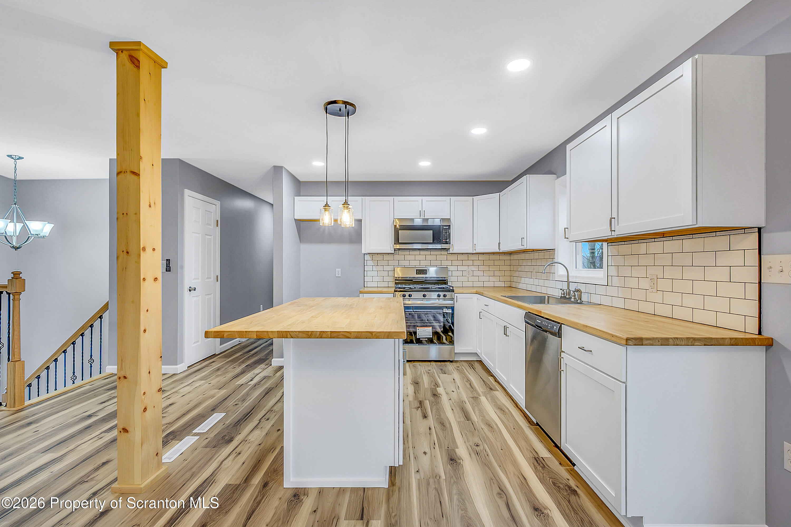 460 Newcomb Road Factoryville, PA 18419 - Photo 3 of 40 a kitchen with stainless steel appliances granite countertop a sink and cabinets