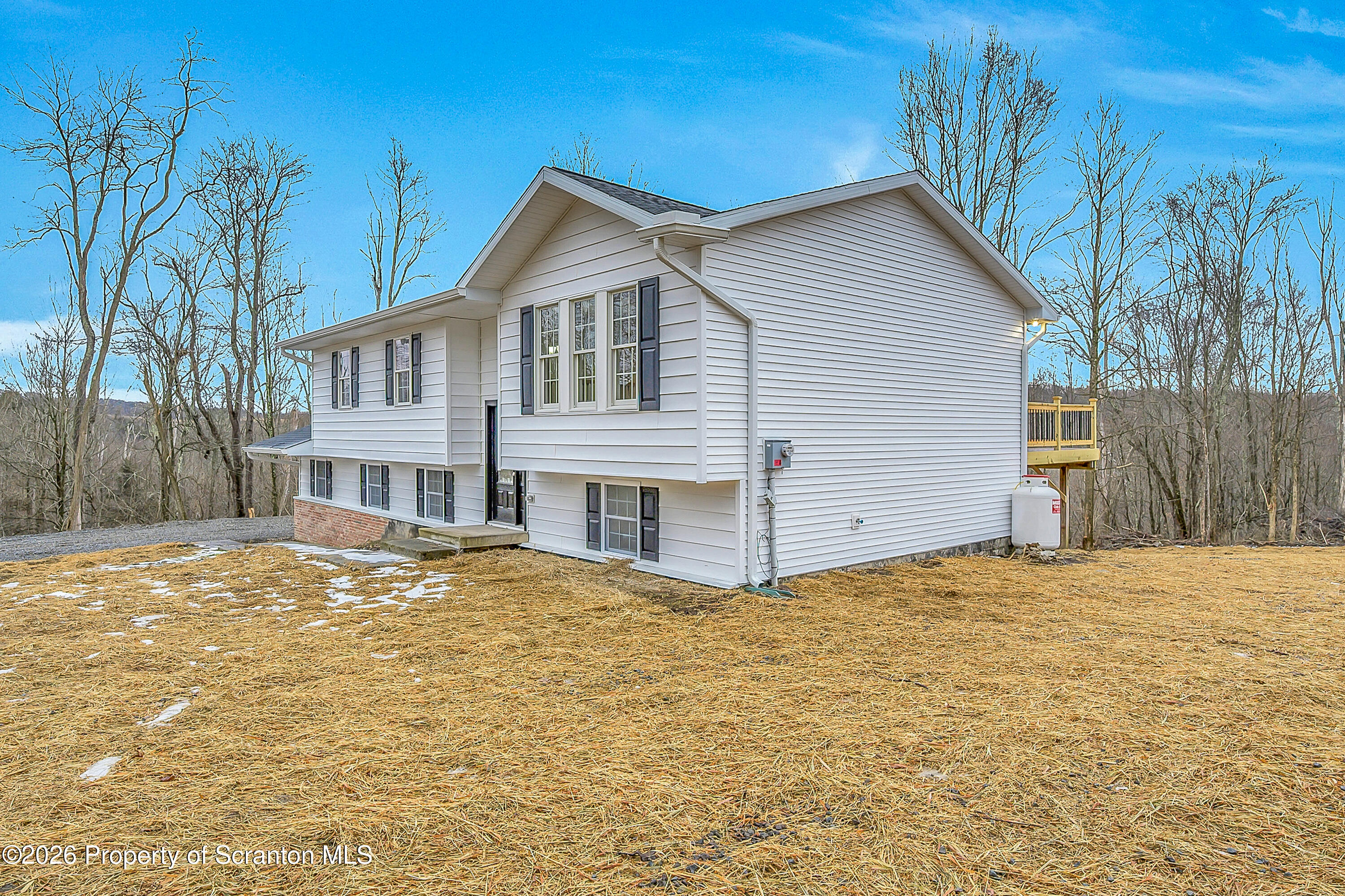 460 Newcomb Road Factoryville, PA 18419 - Photo 32 of 40 a view of a house with a yard