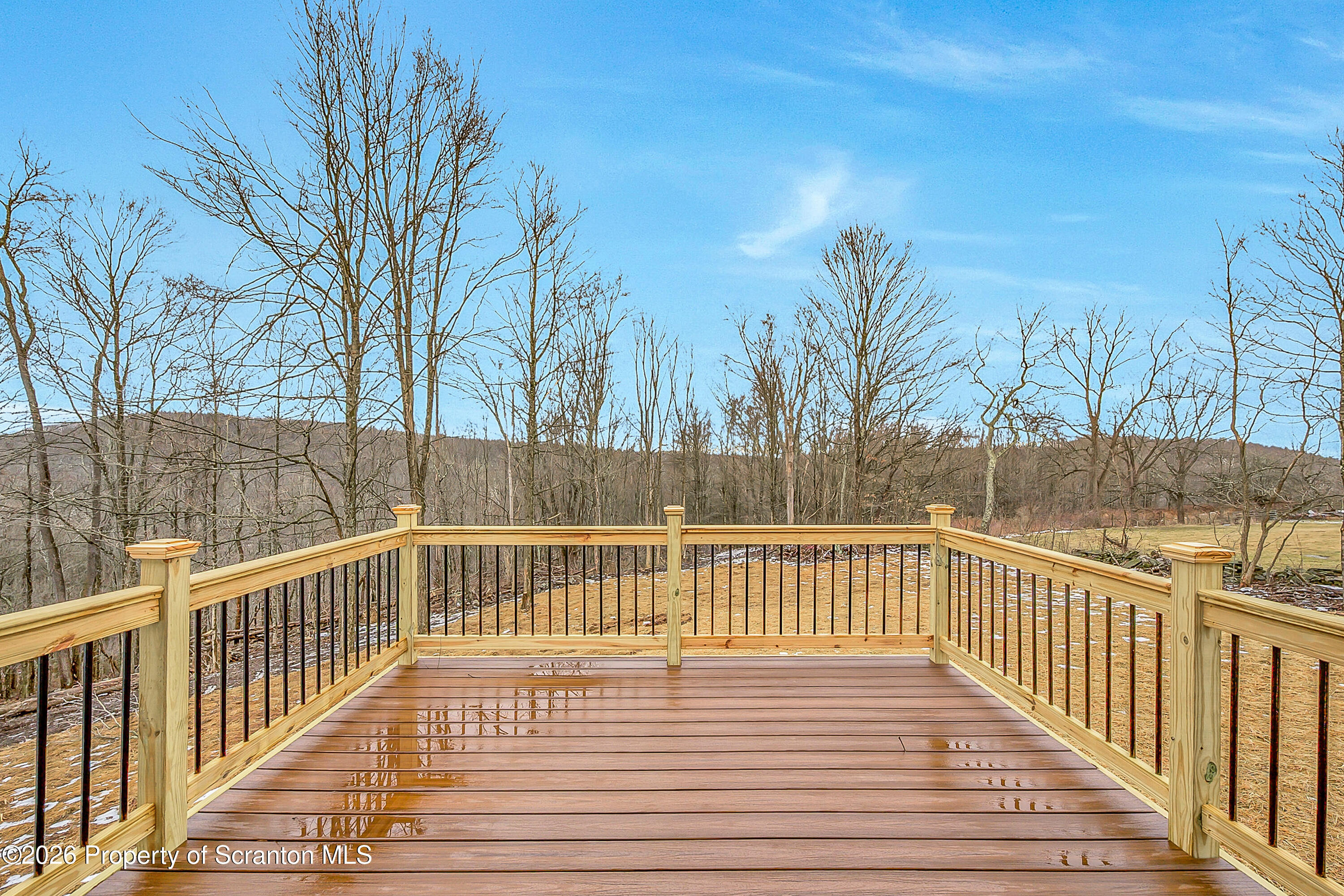 460 Newcomb Road Factoryville, PA 18419 - Photo 33 of 40 a view of a wooden deck with a trees