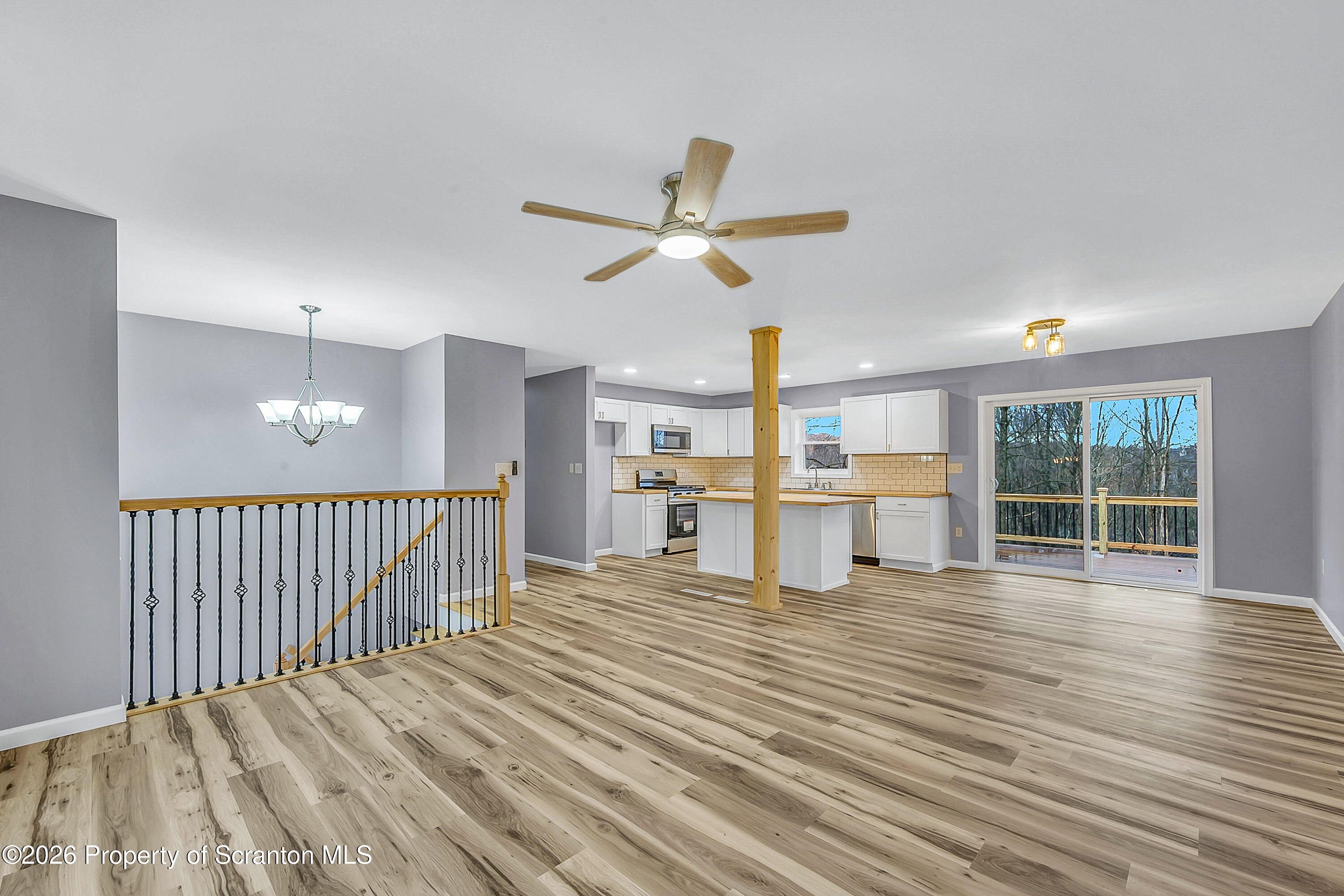 460 Newcomb Road Factoryville, PA 18419 - Photo 6 of 40 a view of a room with wooden floor and windows