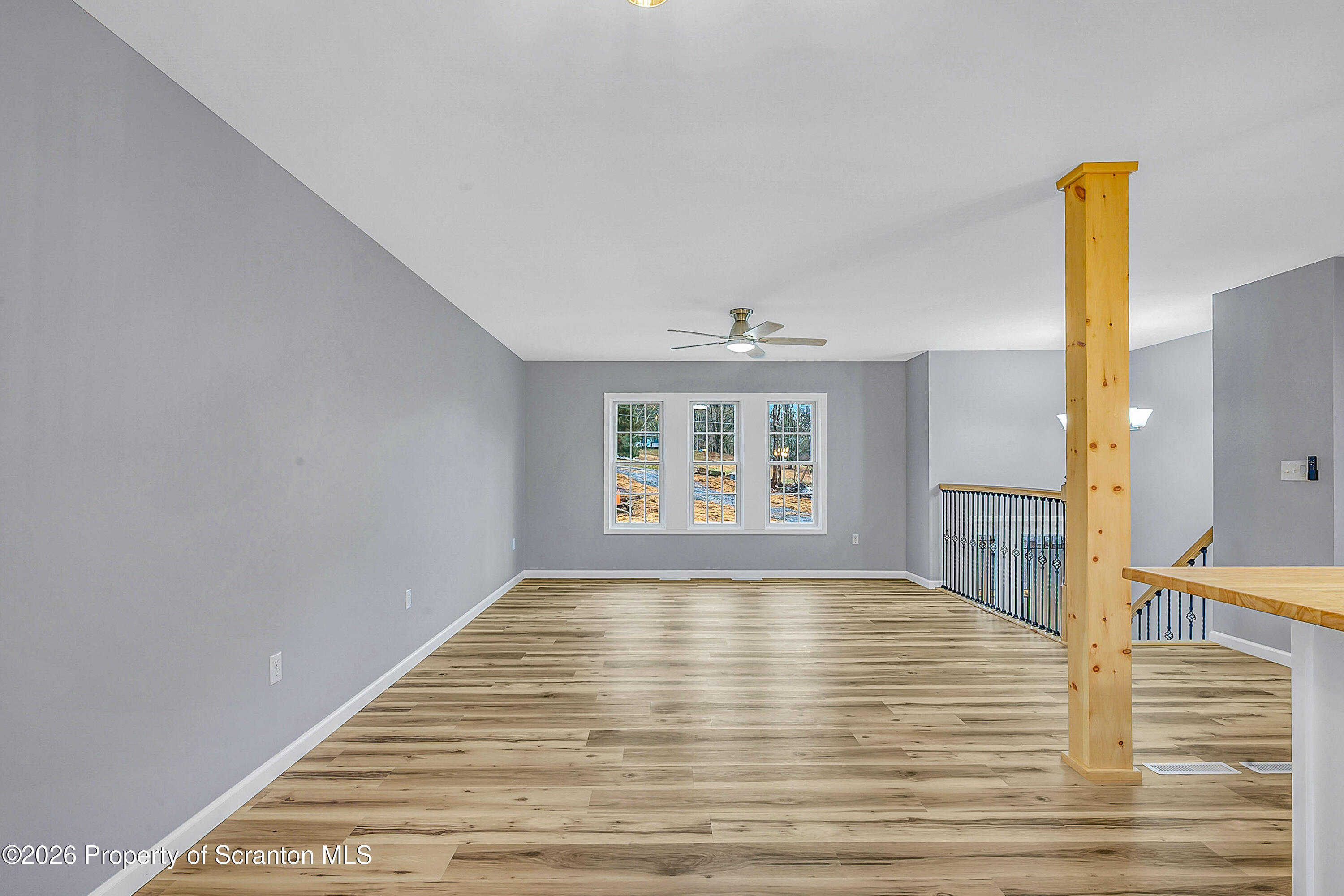460 Newcomb Road Factoryville, PA 18419 - Photo 9 of 40 a view of empty room with wooden floor and window