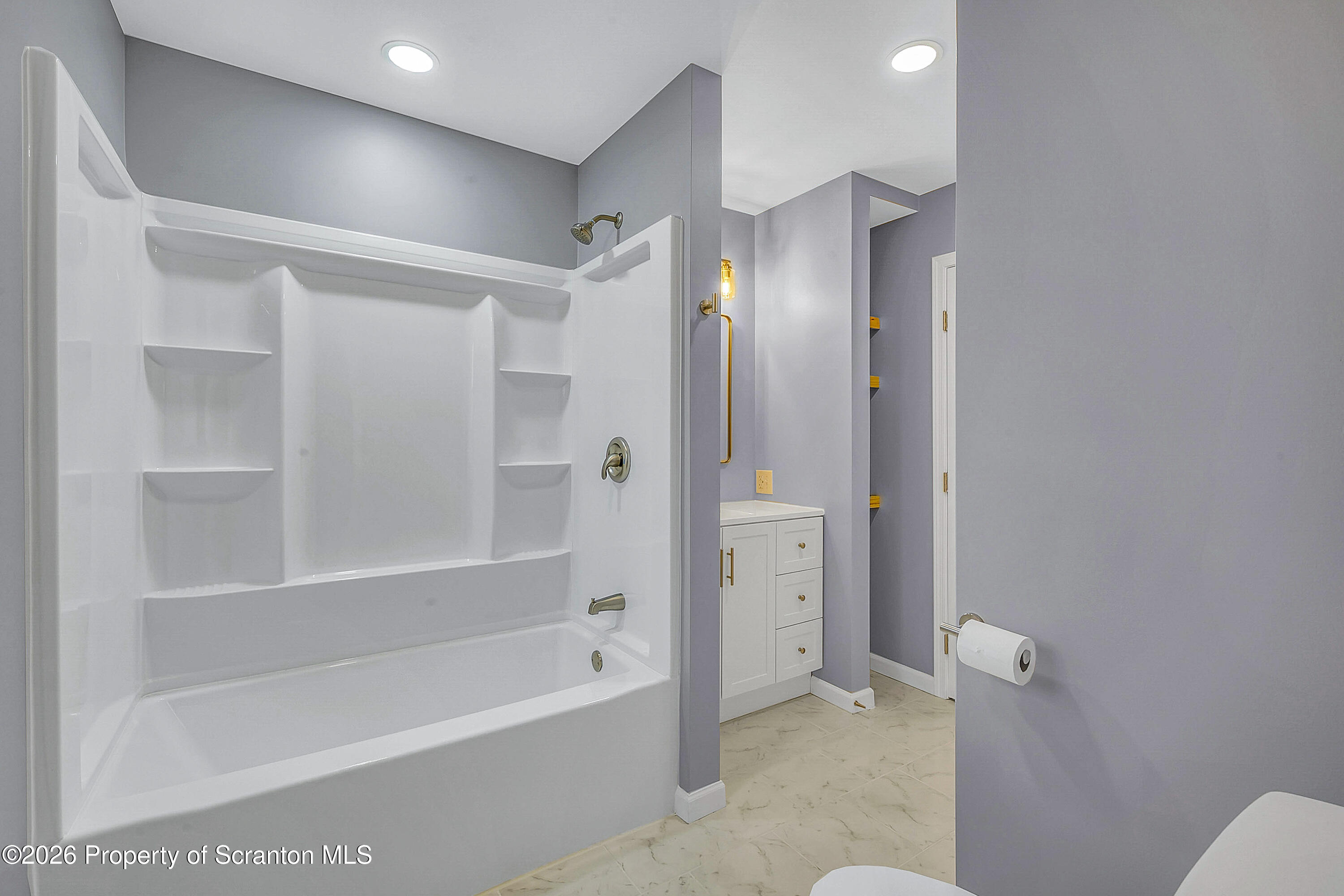 460 Newcomb Road Factoryville, PA 18419 - Photo 10 of 40 a bathroom with a bathtub and a shower