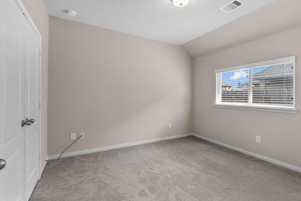 2666 Cedar Path Lane Conroe, TX 77385 - Photo 17 of 22 a view of an empty room with a window