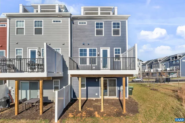 a front view of a building with a yard