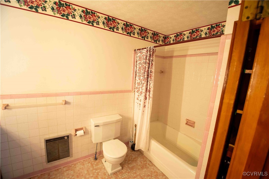 2600 Brunswick Road Blackstone, VA 23824 - Photo 12 of 35 Bathroom featuring tile walls, toilet, shower / tu
