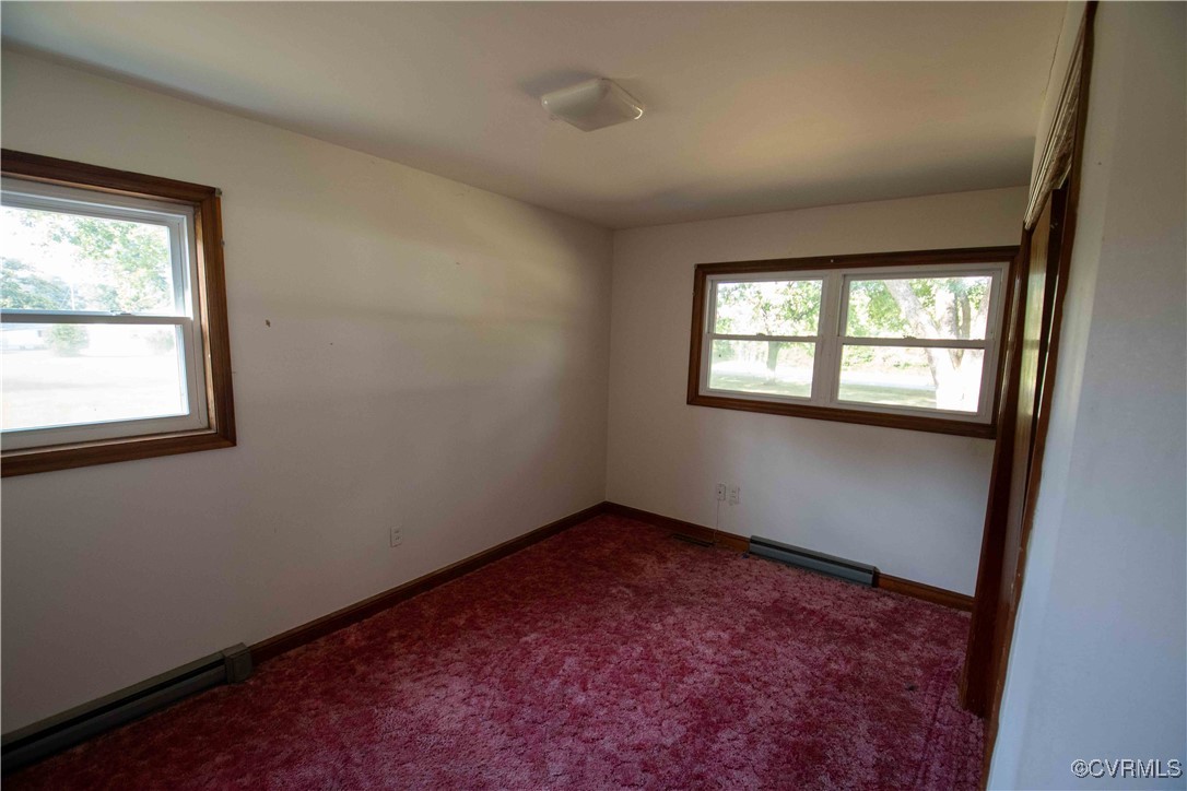 2600 Brunswick Road Blackstone, VA 23824 - Photo 13 of 35 Carpeted empty room featuring baseboard heating