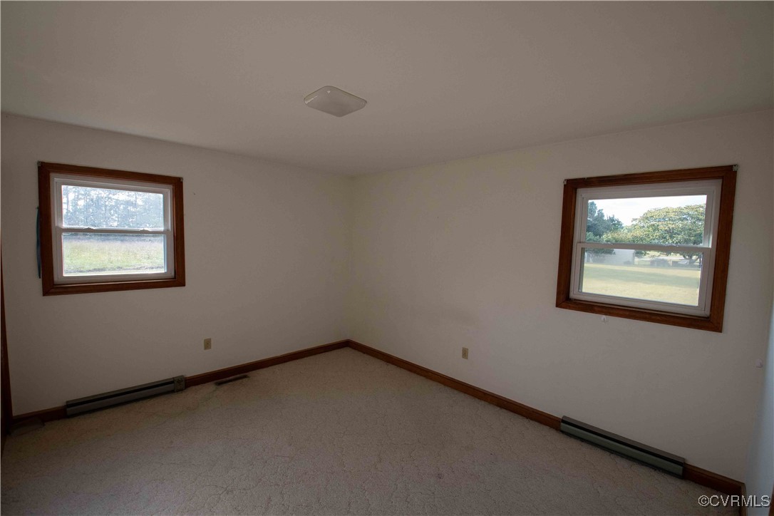 2600 Brunswick Road Blackstone, VA 23824 - Photo 14 of 35 Carpeted spare room featuring baseboard heating