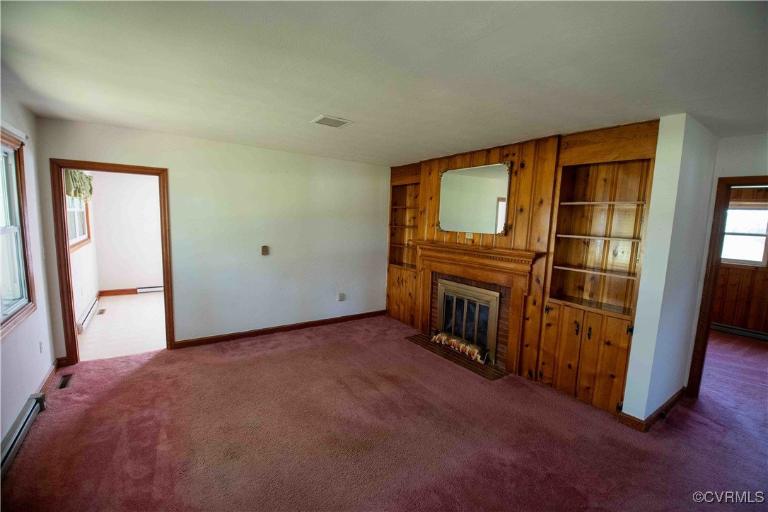 2600 Brunswick Road Blackstone, VA 23824 - Photo 24 of 35 Carpeted living room with baseboard heating
