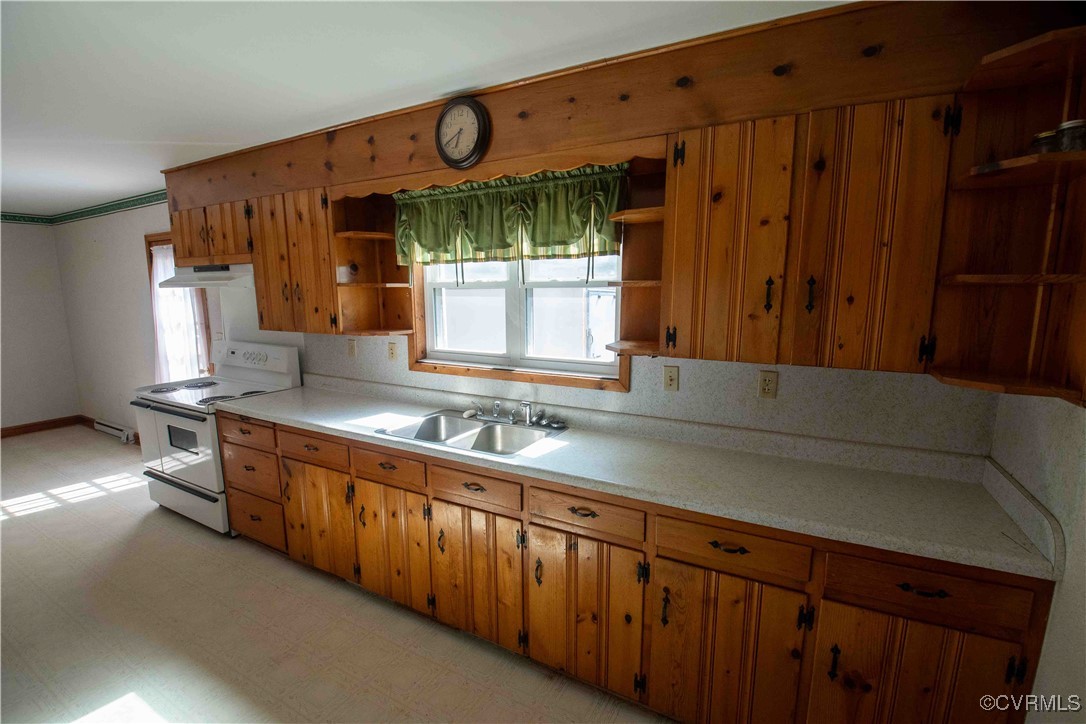 2600 Brunswick Road Blackstone, VA 23824 - Photo 25 of 35 Kitchen featuring white stove, a healthy amount of