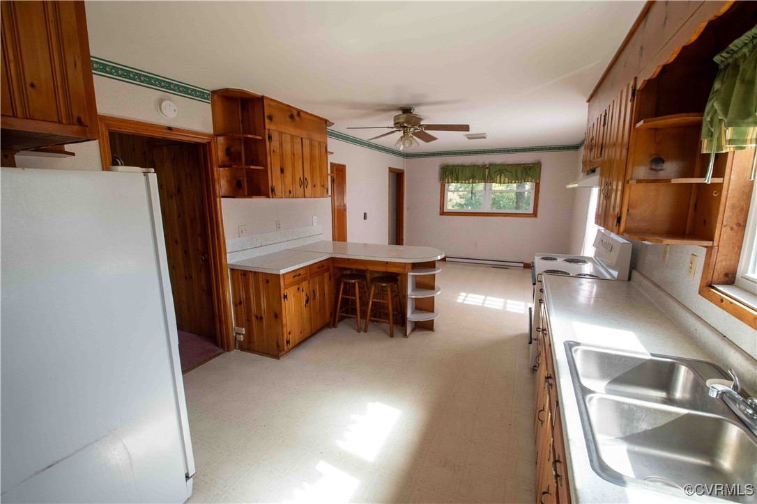 2600 Brunswick Road Blackstone, VA 23824 - Photo 26 of 35 Kitchen featuring a baseboard heating unit, white