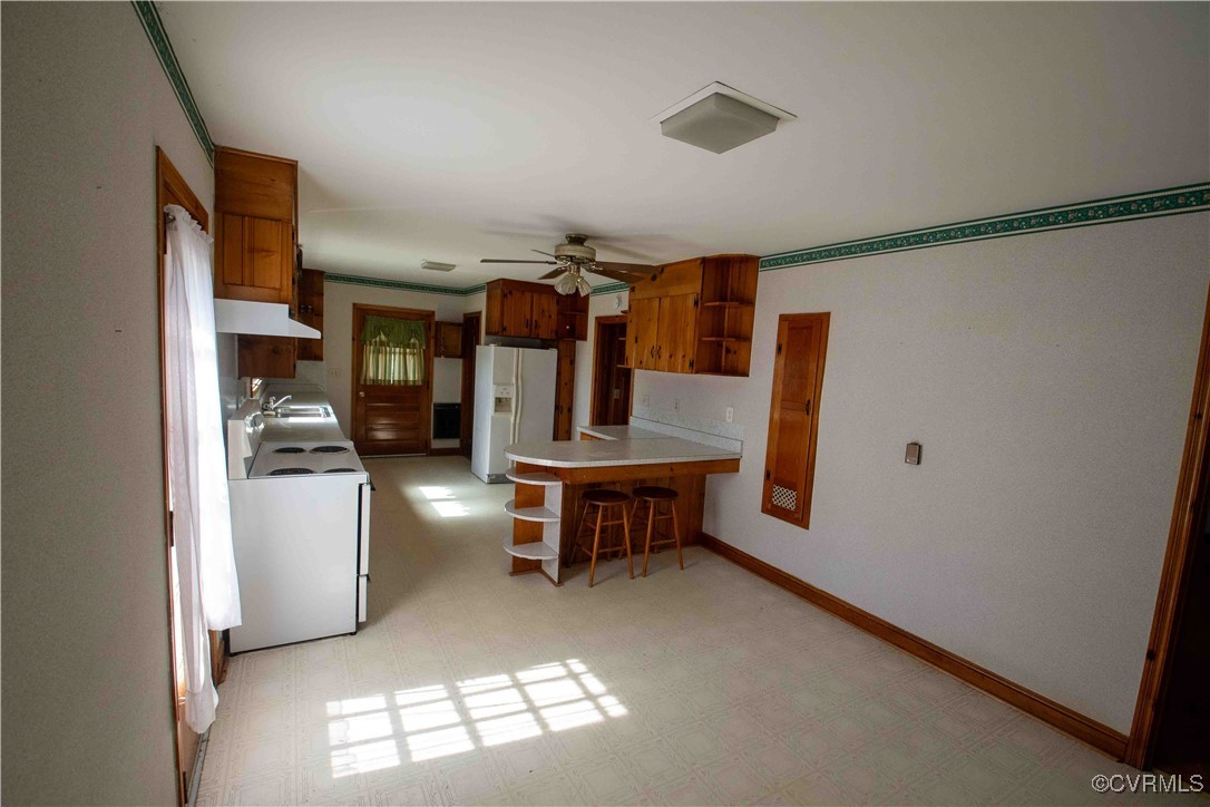 2600 Brunswick Road Blackstone, VA 23824 - Photo 27 of 35 Kitchen featuring white appliances, kitchen penins