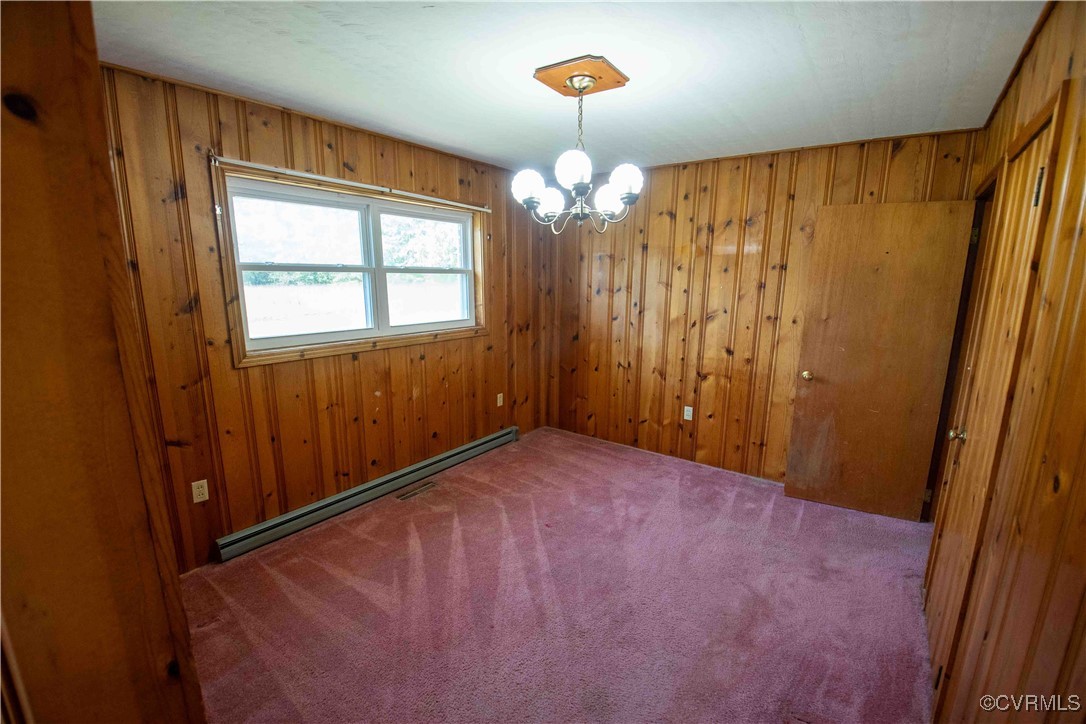 2600 Brunswick Road Blackstone, VA 23824 - Photo 28 of 35 Carpeted empty room with an inviting chandelier, a