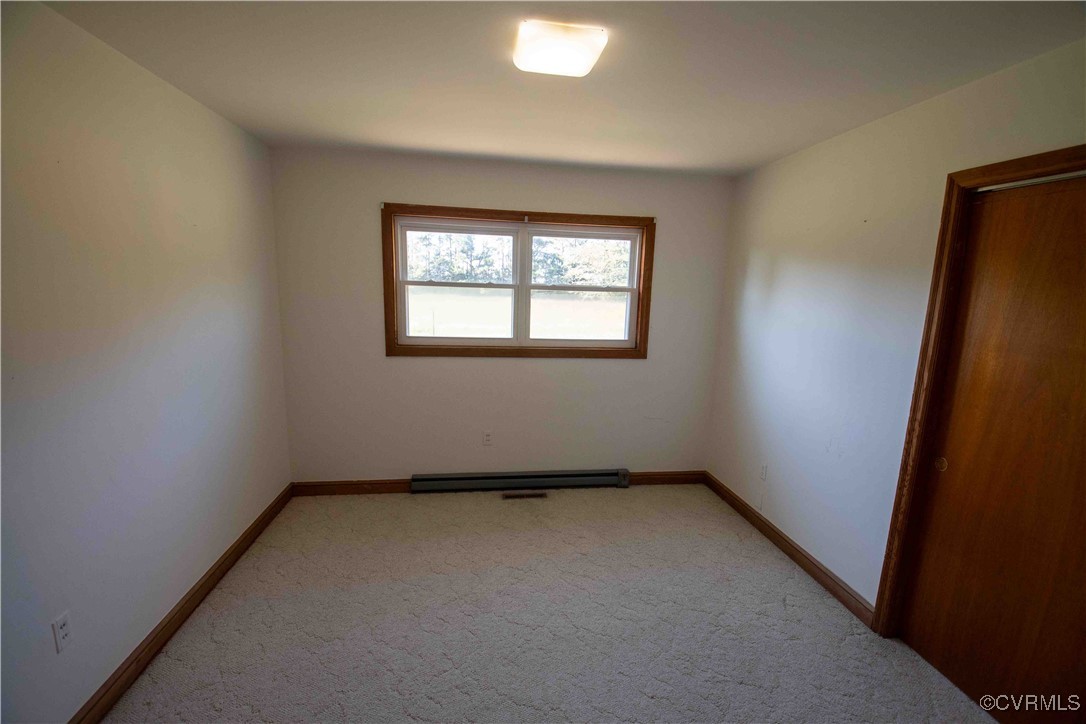 2600 Brunswick Road Blackstone, VA 23824 - Photo 29 of 35 Unfurnished room featuring carpet floors and a bas