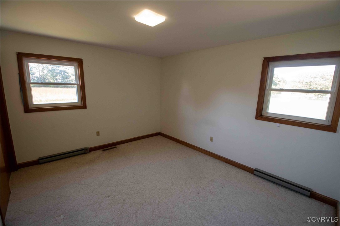 2600 Brunswick Road Blackstone, VA 23824 - Photo 32 of 35 Carpeted empty room featuring baseboard heating an