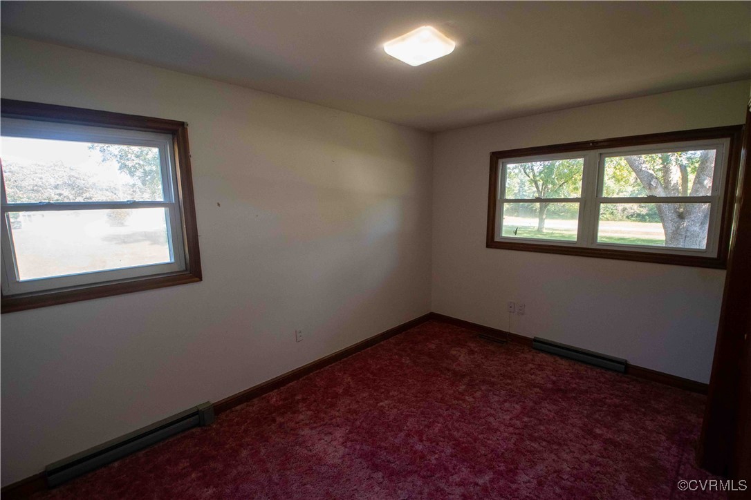 2600 Brunswick Road Blackstone, VA 23824 - Photo 33 of 35 Carpeted empty room with a baseboard radiator and