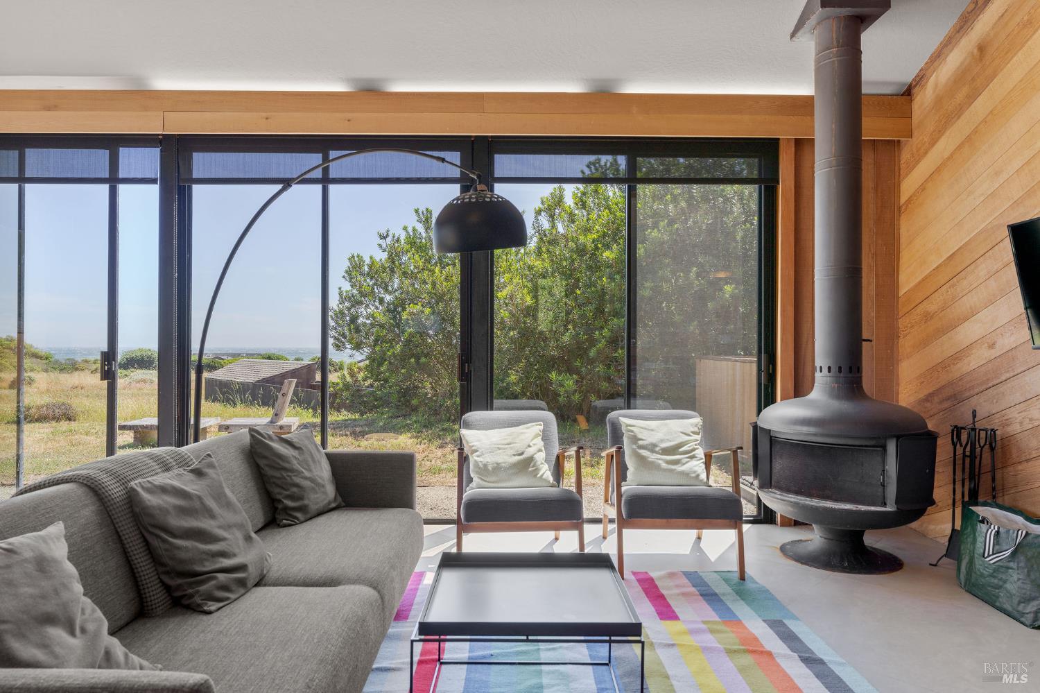 39412 Pacific Reach The Sea Ranch, CA 95497 - Photo 11 of 31 a living room with furniture and a large window