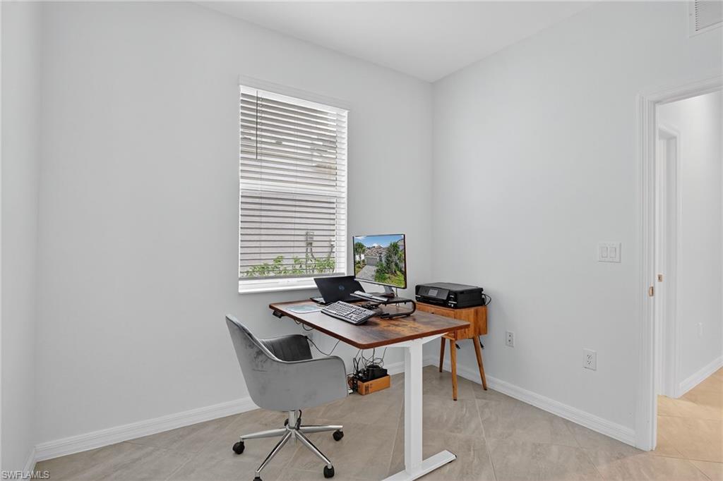 2126 Hamlin Street Naples, FL 34120 - Photo 22 of 38 a view of a workspace with furniture