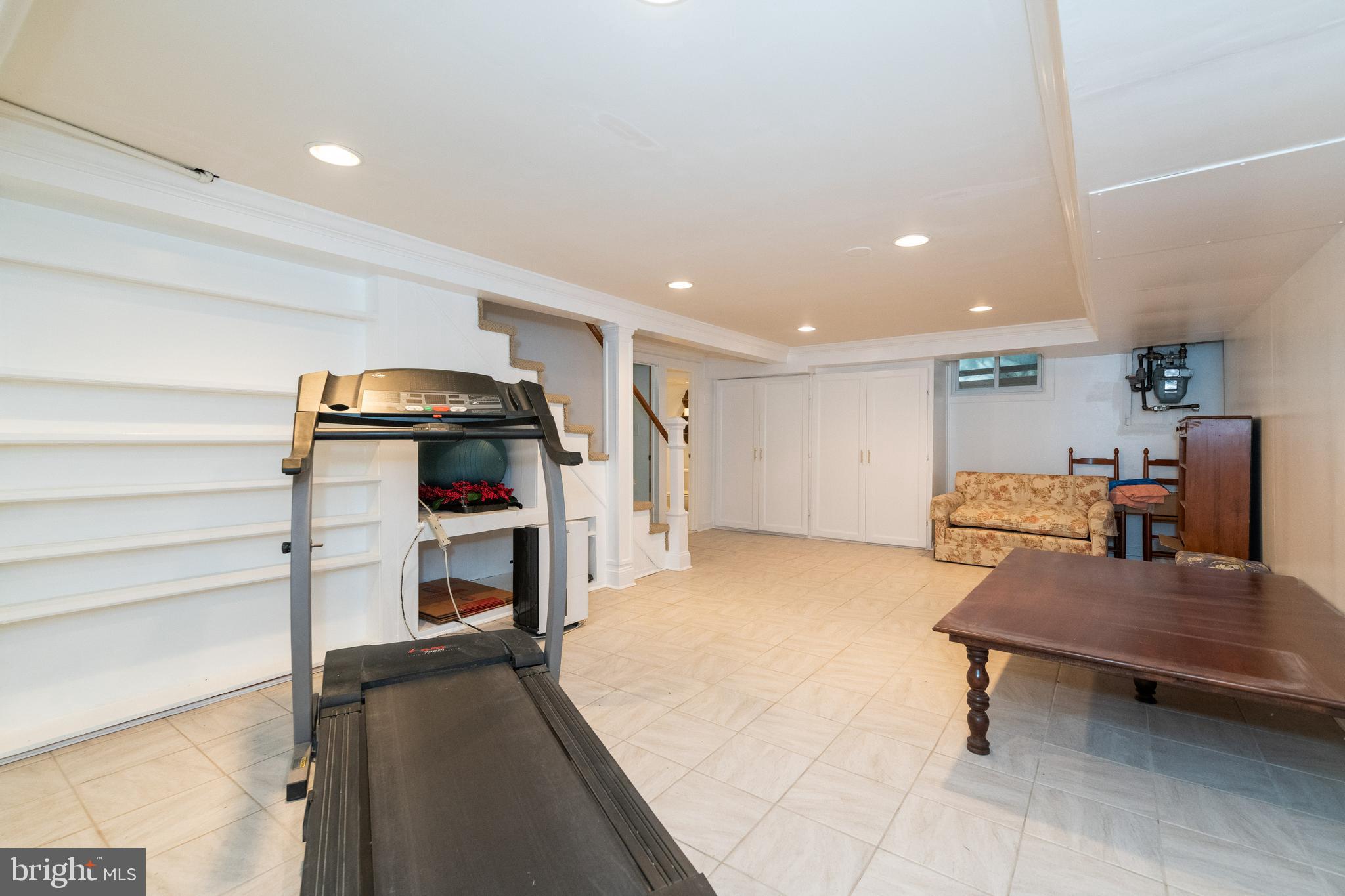 112 Greenbrier Road Towson, MD 21286 - Photo 22 of 37 Tiled floor, built in storage, recessed lights.