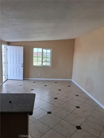 an empty room with wooden floor and closet