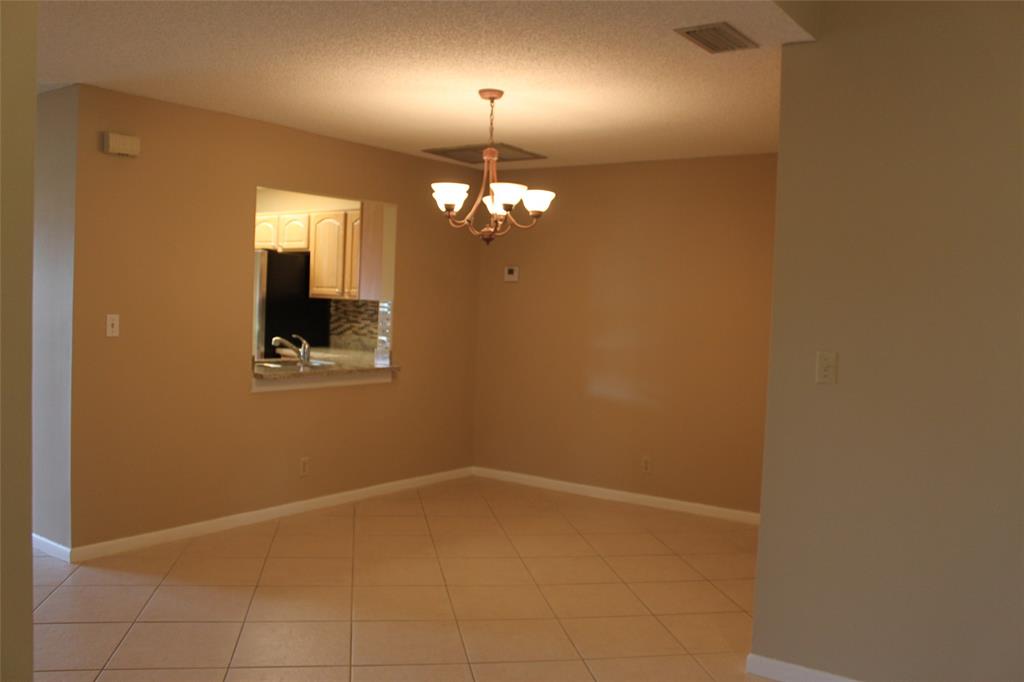 7044 Lantana Lane Tamarac, FL 33321 - Photo 3 of 7 a view of a livingroom with a window