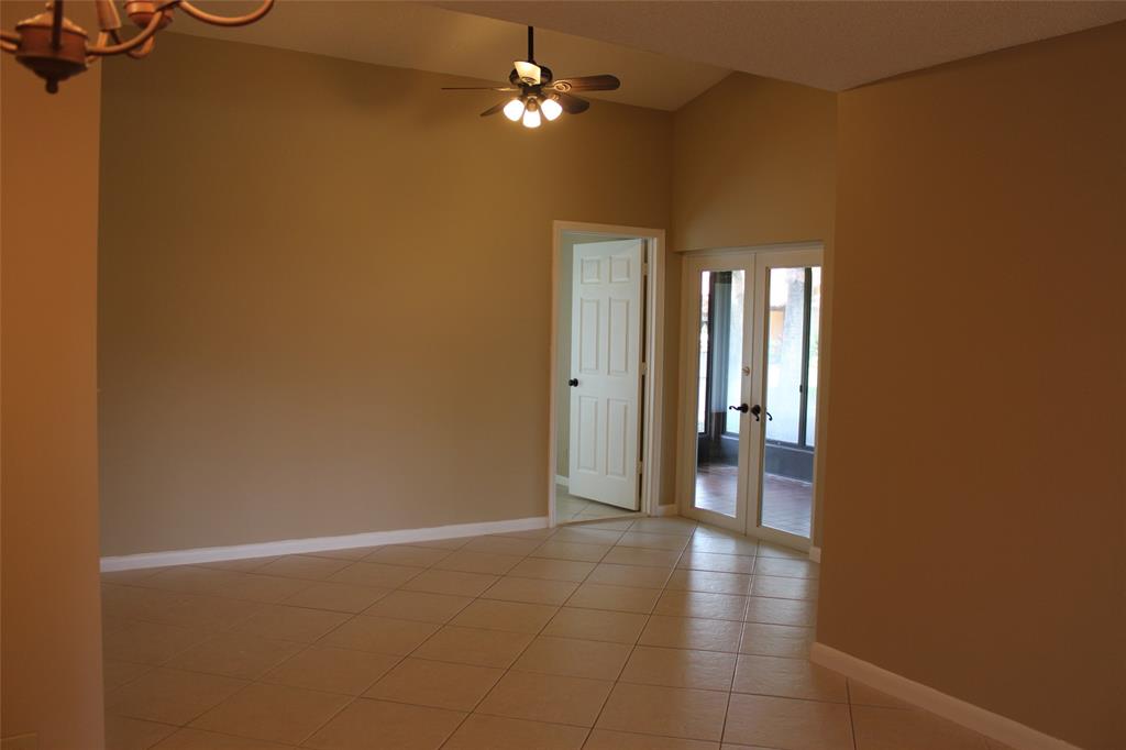 7044 Lantana Lane Tamarac, FL 33321 - Photo 4 of 7 a view of a livingroom with a chandelier fan