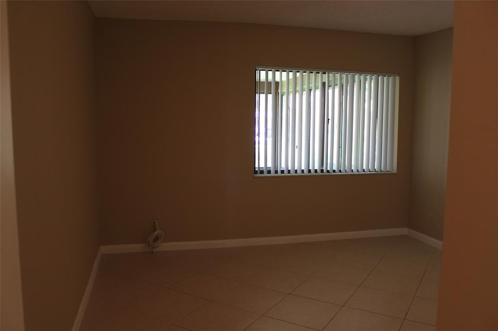 7044 Lantana Lane Tamarac, FL 33321 - Photo 7 of 7 an empty room with a window